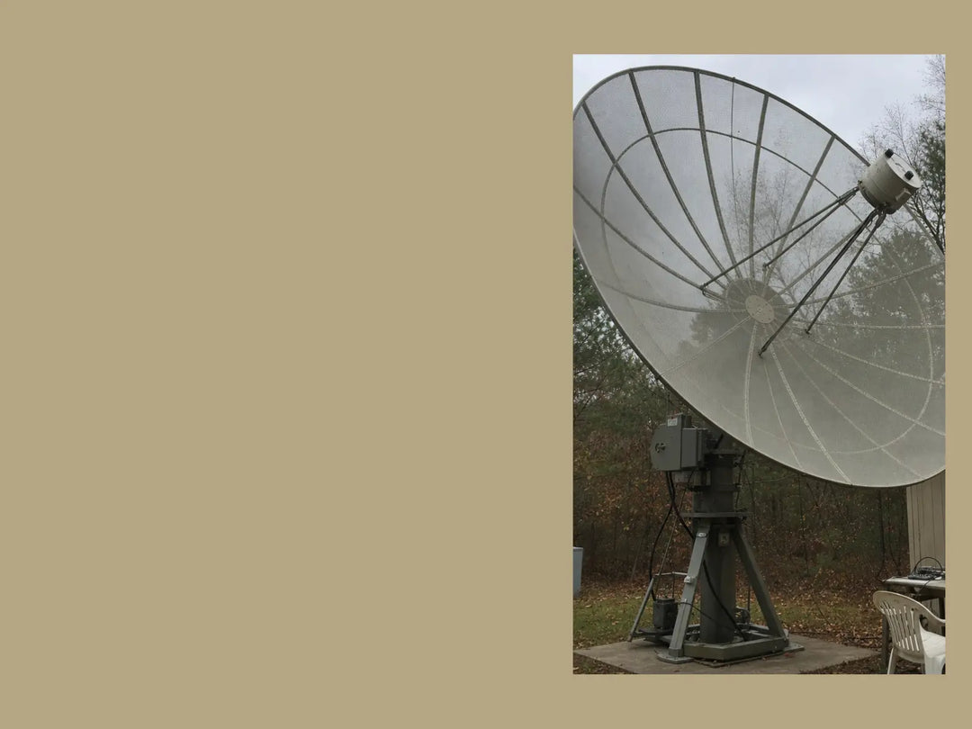 A large parabolic dish antenna used by a ham radio operator for deep space listening