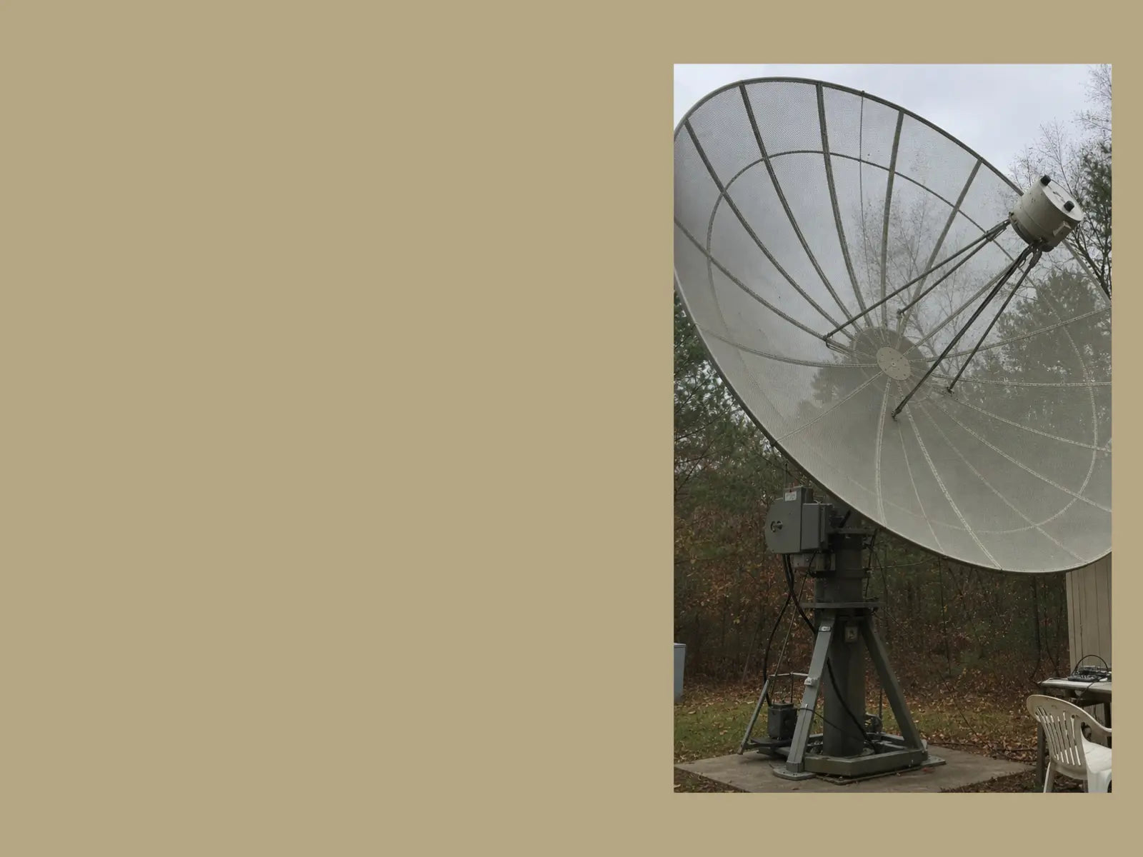 A large parabolic dish antenna used by a ham radio operator for deep space listening