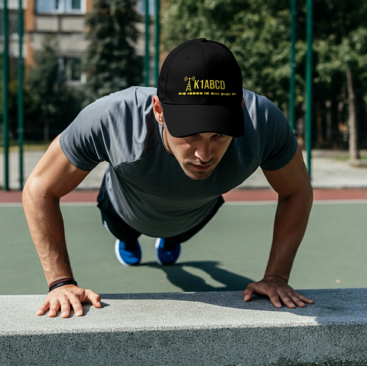 Man wearing a personalized ham radio cap with a custom callsign and Morse code while exercising outdoors.