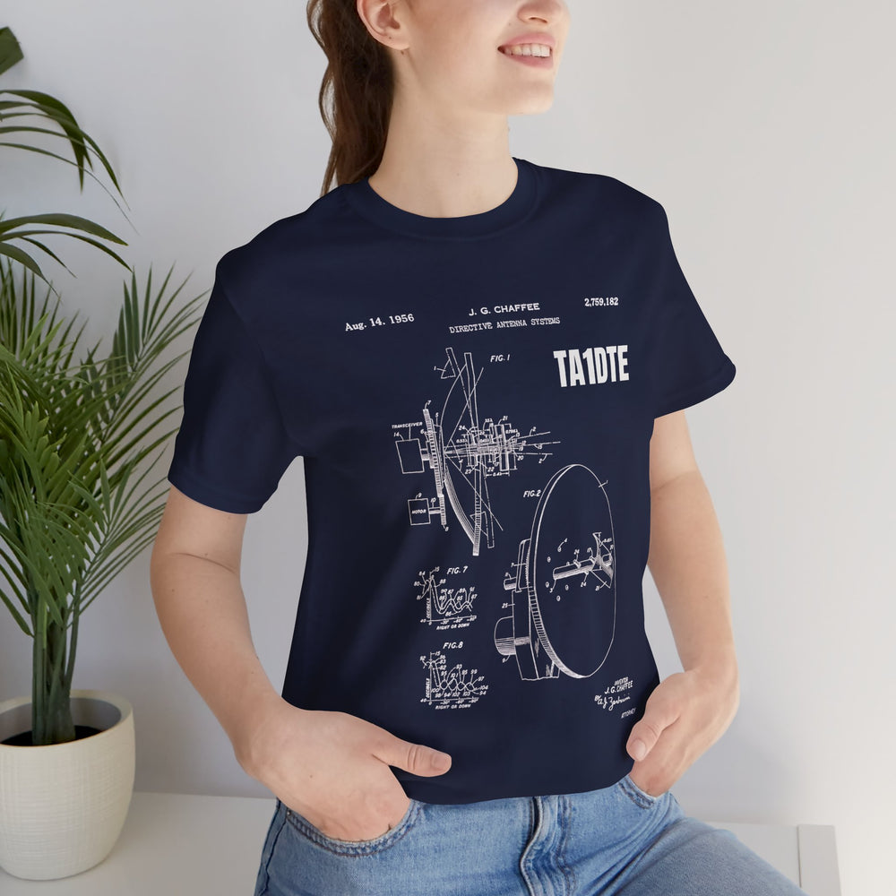 Amateur radio operator wearing a personalized antenna blueprint T-shirt with a custom callsign.