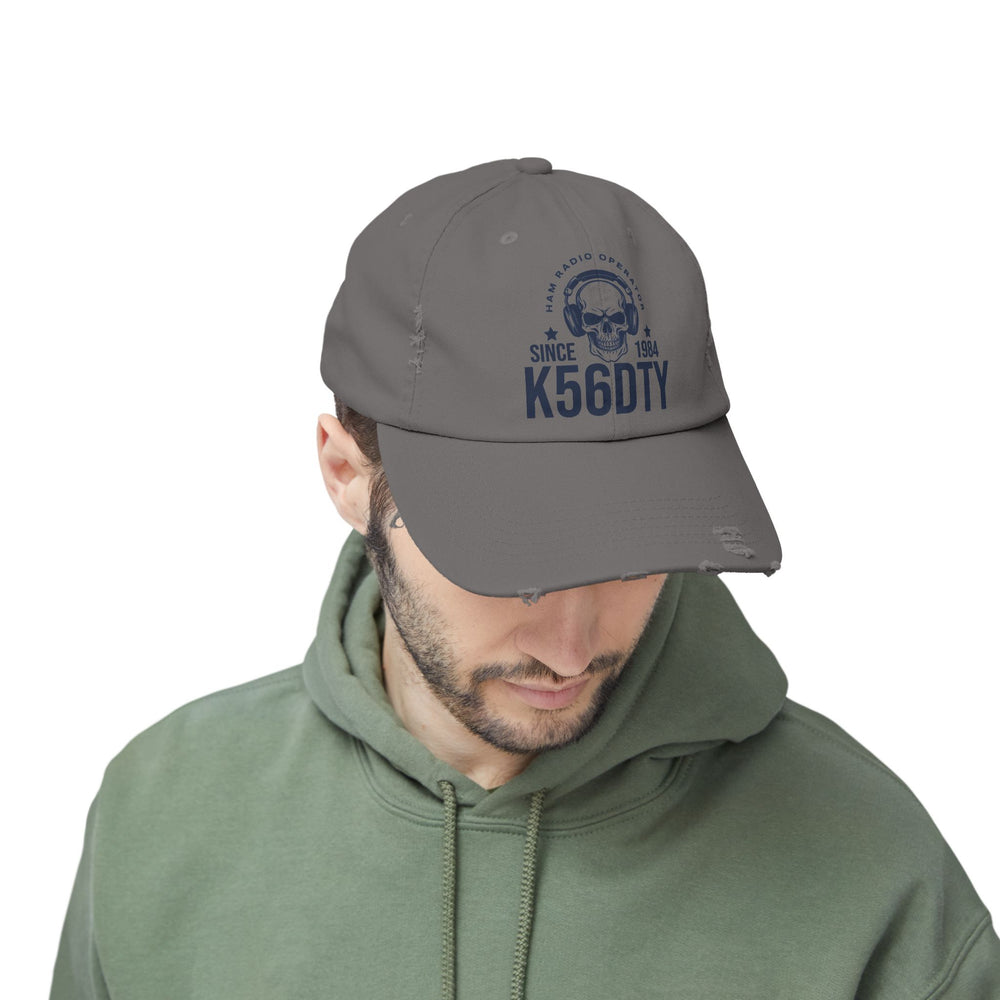 Personalized distressed ham radio cap featuring skull headset artwork, custom callsign, and licensed year.