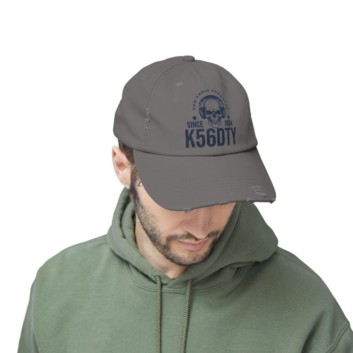 Personalized distressed ham radio cap featuring skull headset artwork, custom callsign, and licensed year.