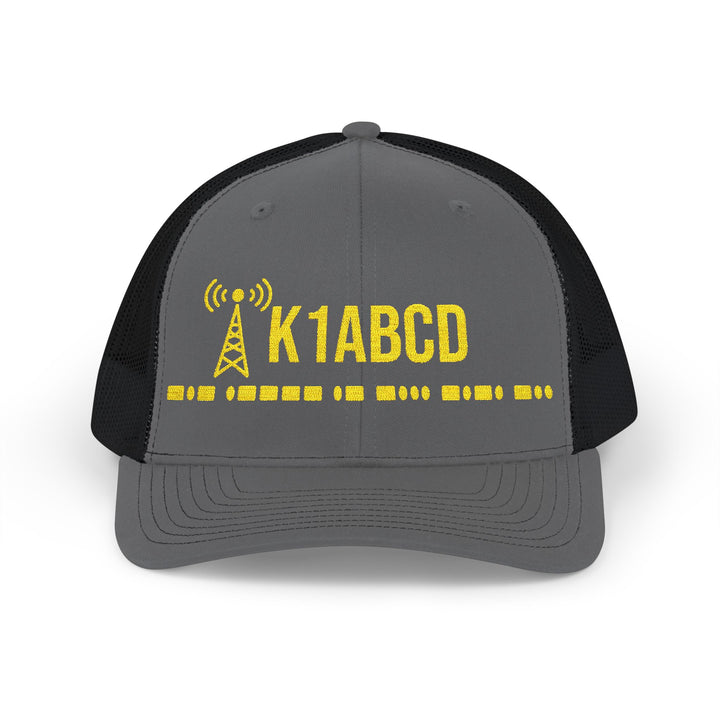 Close-up of personalized callsign and authentic International Morse Code embroidery on a Richardson 112 ham radio trucker hat.