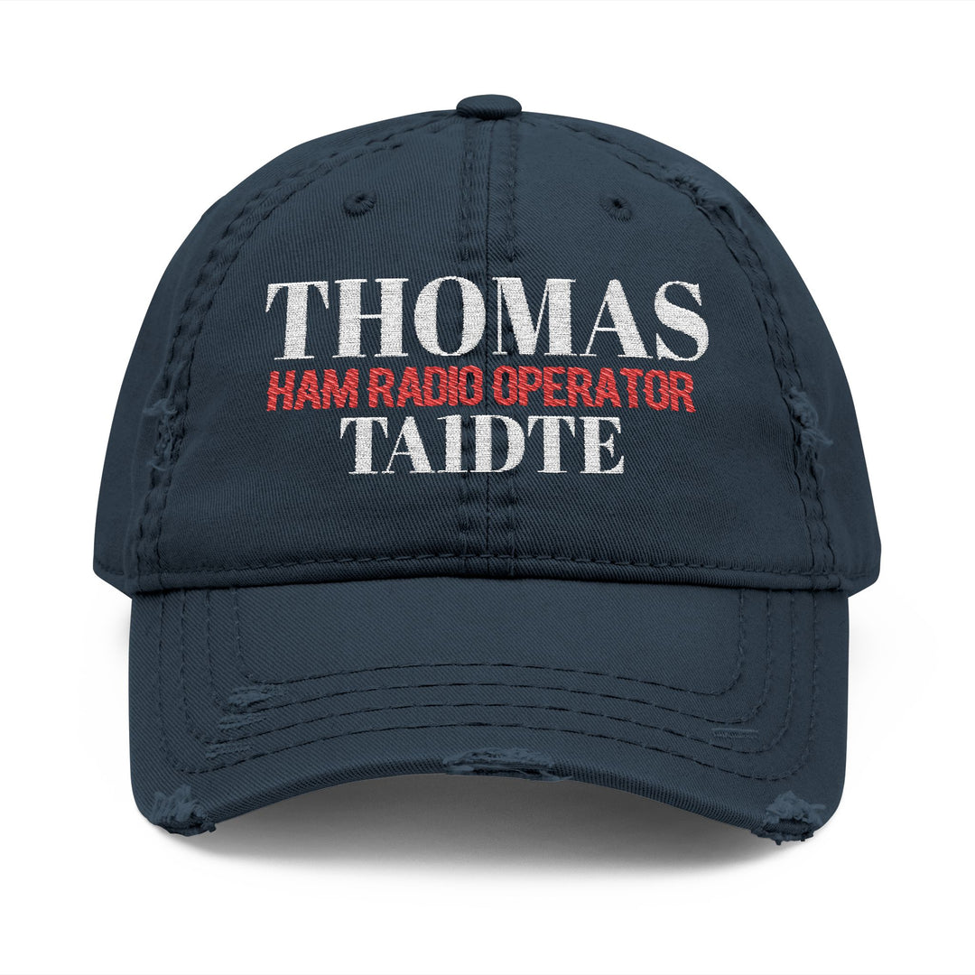 navy cap with embroidered callsign and name on it