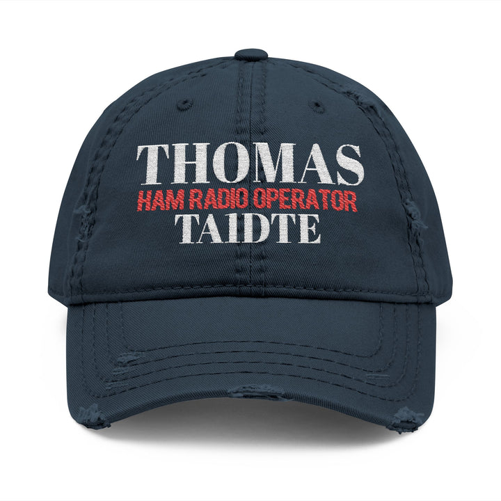 navy cap with embroidered callsign and name on it