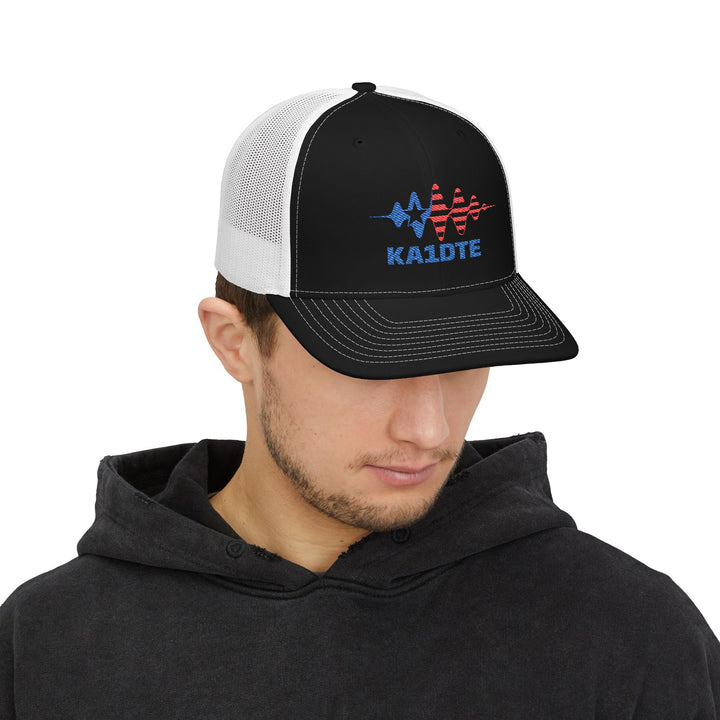 Model wearing personalized Richardson 112 embroidered ham radio hat with custom callsign.