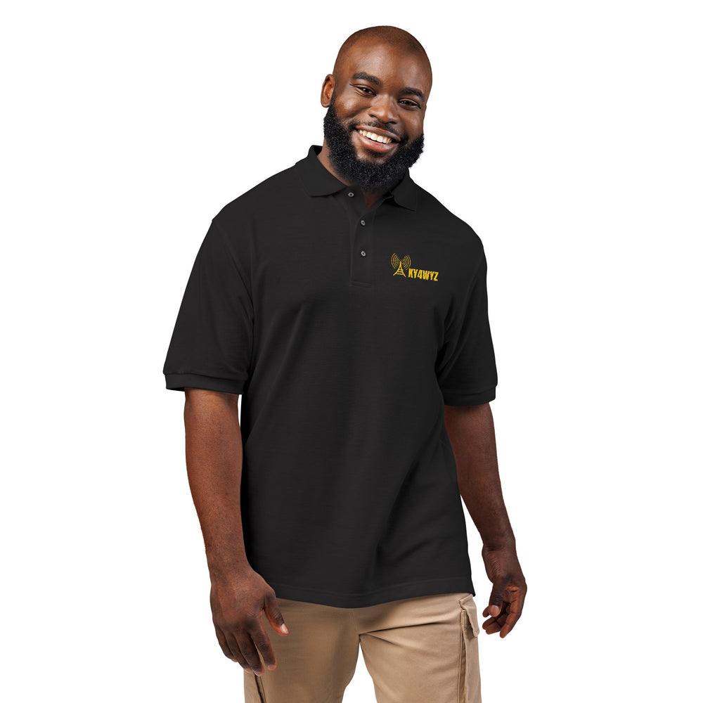 Man wearing a personalized ham radio polo shirt embroidered with a custom amateur radio callsign and antenna design.