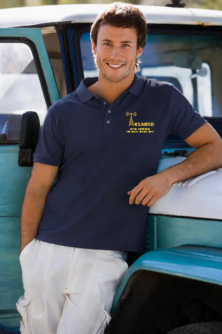 Licensed amateur radio operator wearing a personalized embroidered ham radio polo shirt with custom callsign and Morse code -insignia color