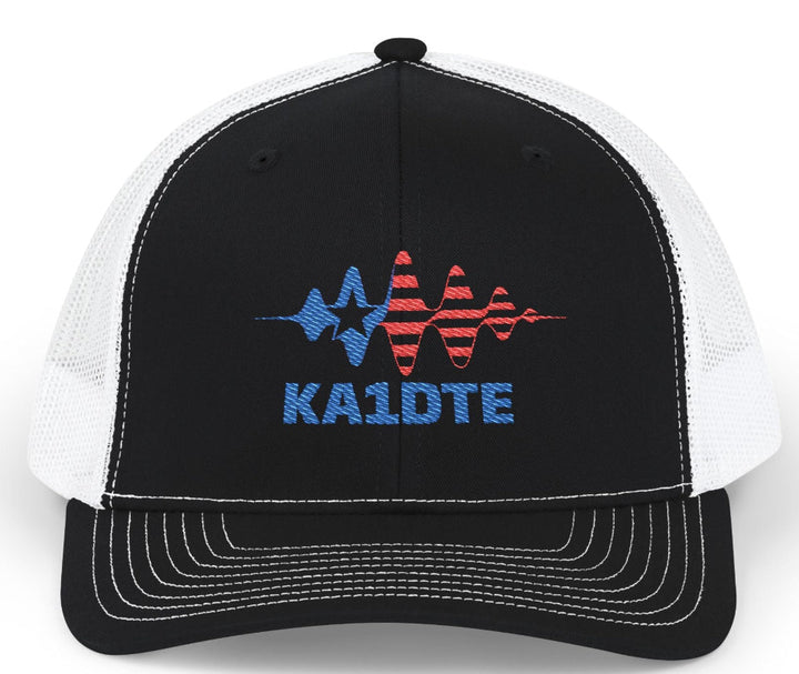 Personalized Richardson 112 ham radio hat with custom embroidered amateur radio callsign on black and white trucker cap.
