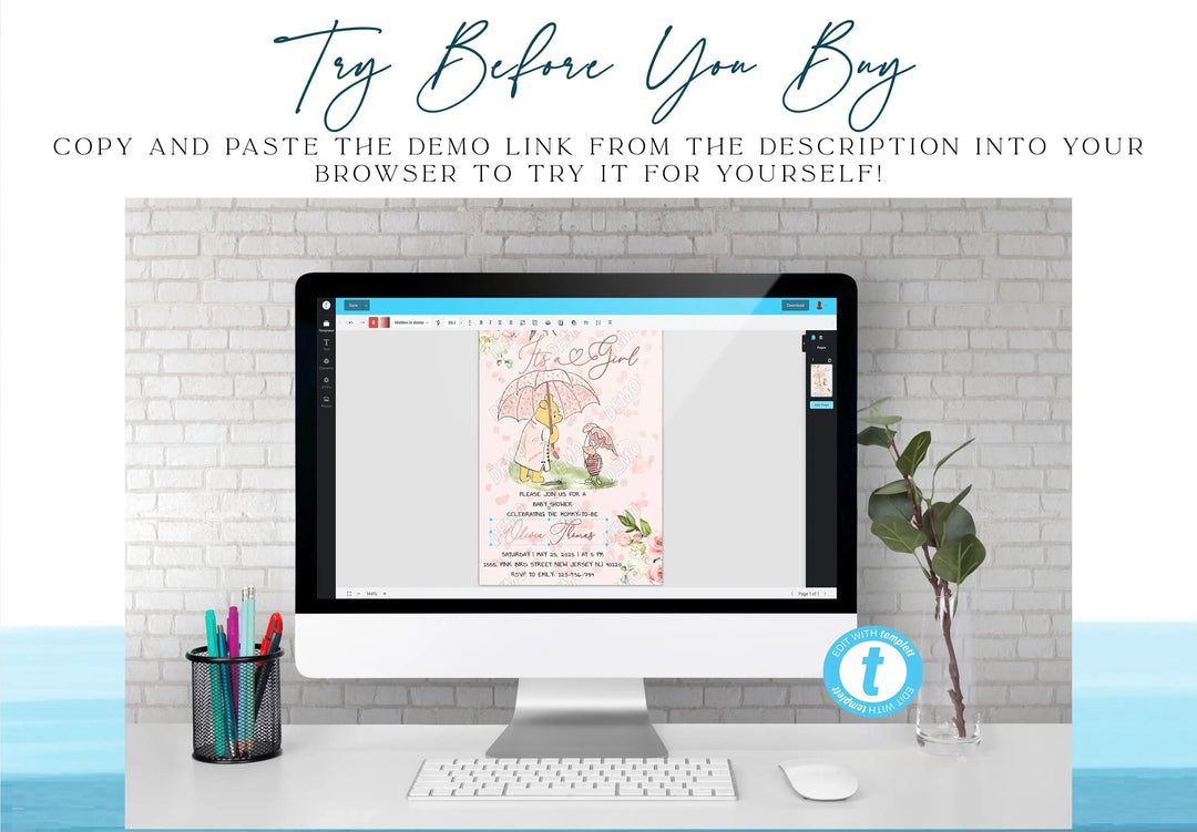 Computer monitor displaying a design on a desk with a plant and stationery items.