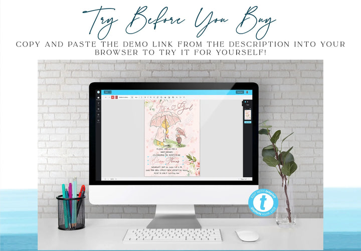 Computer monitor displaying a design on a desk with a plant and stationery items.